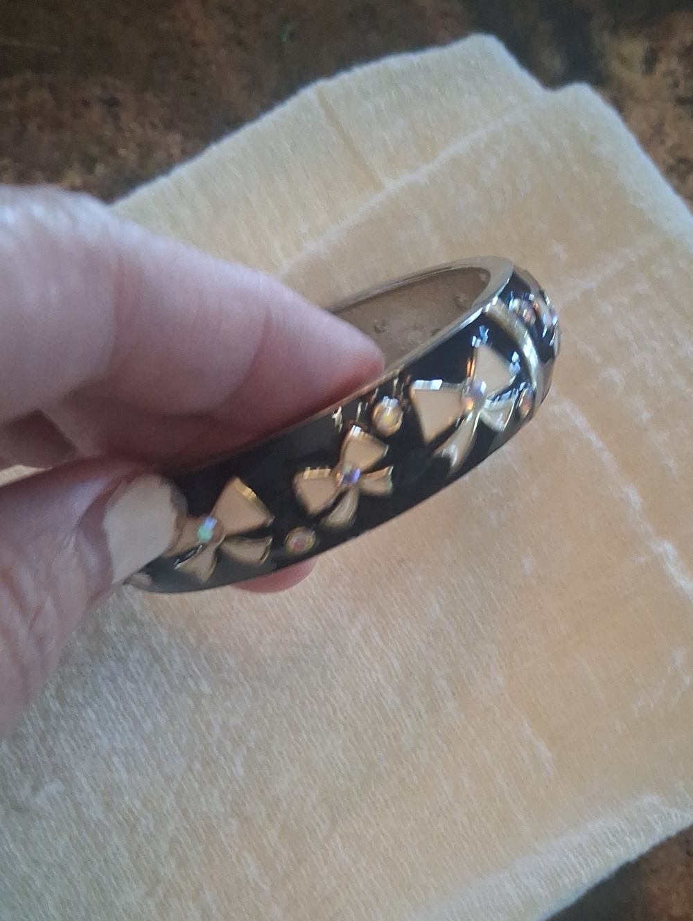 Black Enamel Bangle Bracelet with Gold Bow Accents